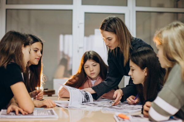 Teacher with students